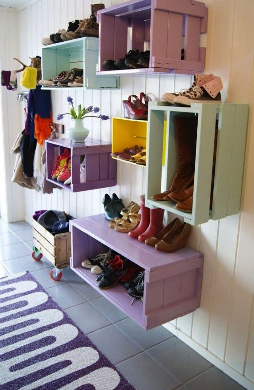 Colored crates nailed to the wall create extra mudroom storage.