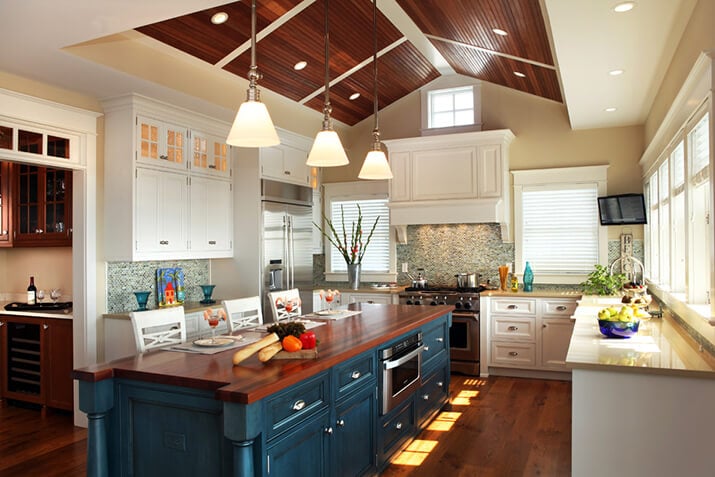Kitchen with kitchen island featuring wood countertops.
