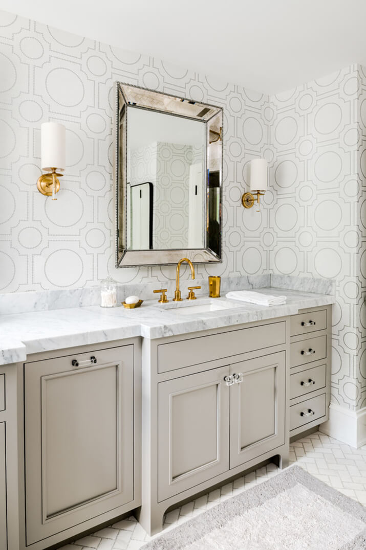 Bathroom with subtle geometric wallpaper.