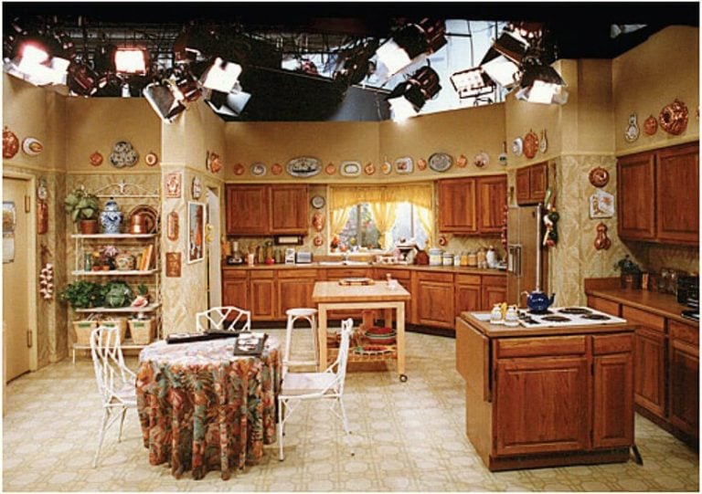 tv show kitchen with plates on wall