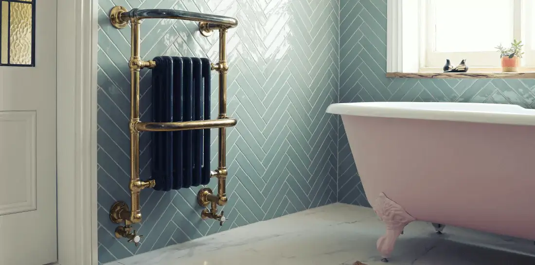 Light sage green bathroom with clawfoot tub
